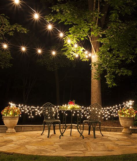 String lights from a tree to your deck space, so your yard is lit up. How to Plan and Hang Patio Lights