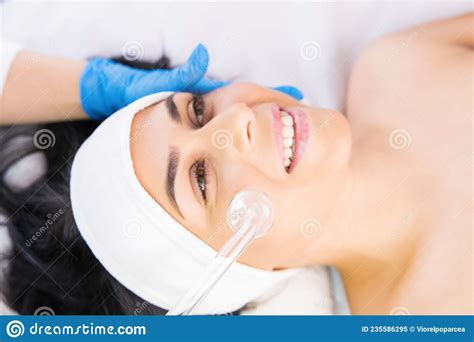 The Cosmetologist Makes The Procedure For Peeling Of The Face Skin Of A