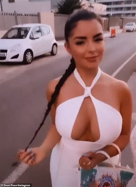 Demi Rose Strikes A Sultry Pose In A Bright White Dress As She Parties