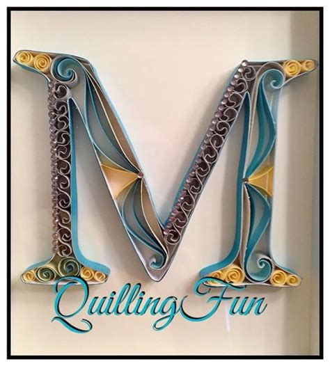 Our experts have written this section for you. From www Facebook.com/QuillingFun. A quilled letter "M" using the colors gray, yellow, and ...