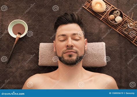 Young Man Relaxing On Massage Table In Spa Salon Stock Image Image Of