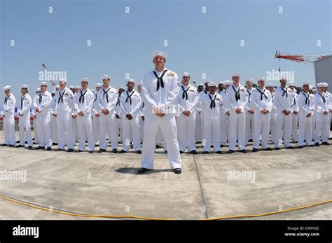 Sailors Stand At Ease During A Change Of Command Ceremony Aboard The