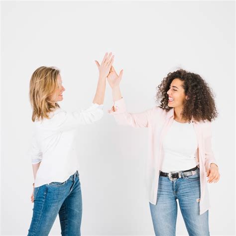 High Fiving Women On White Photo Free Download