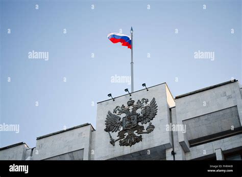 National Emblem Russian Federation And Flag Of The Russian Federation