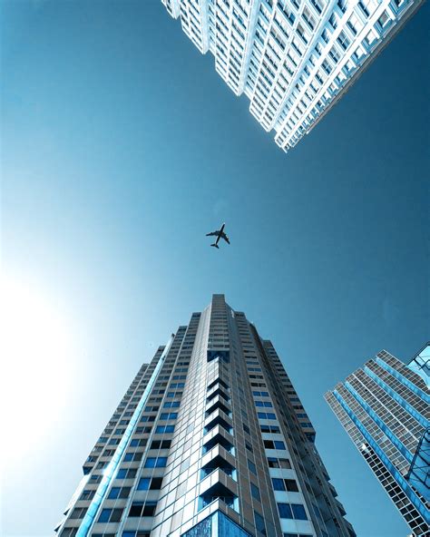 Airplane Flying Over The City · Free Stock Photo