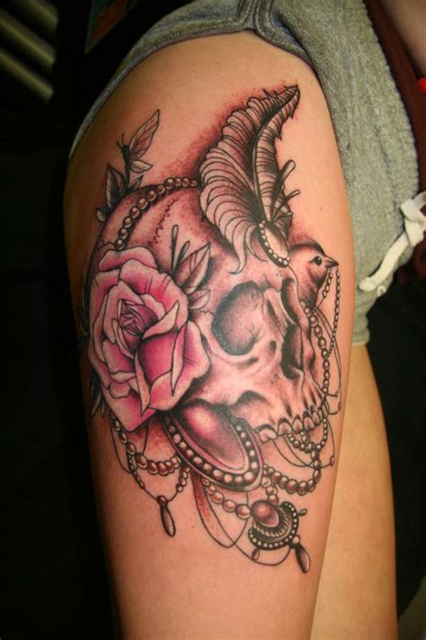 Couples can try matching skull candy tattoos and a cool idea would be to tie up two skulls along with pretty flowers just like this. Skull and Roses Tattoos Designs, Ideas and Meaning ...