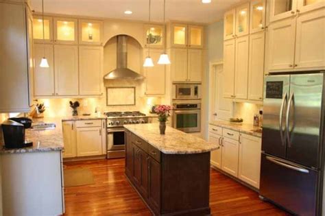 Whether you choose to go with a light or dark this dark hardwood floor is matched wonderfully by the dark center island. Cream cabinets, dark island, wood floors | kitchen | Pinterest | Nice, Islands and Beautiful