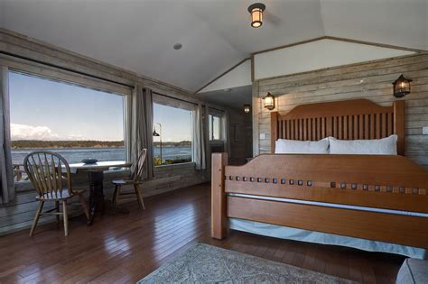 Many cabins are located right beside the river. Dolphins Resort & Anglers Dining- Oceanfront Cabins ...