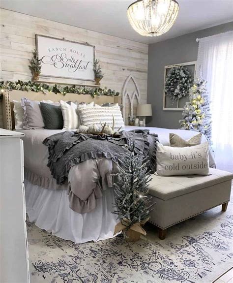 A Bedroom Decorated For Christmas With White And Gray Decor Silver