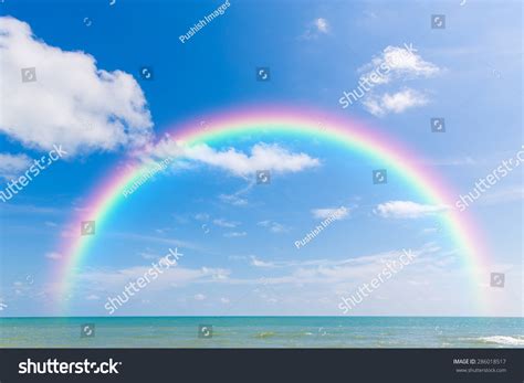 Rainbow Over Sea With Blue Sky And Cloud Stock Photo 286018517