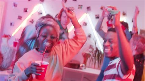 Joyous African American Couple Dancing With Friends At Home Party Stock Footage