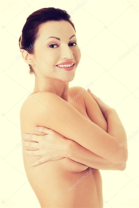 Joven belleza mujer desnuda cubriendo su pecho fotografía de stock piotr marcinski