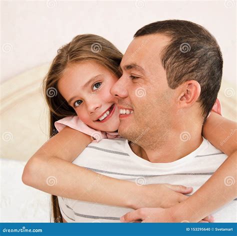 Smiling Happy Little Daughter Child Embracing Her Father Sharing Love