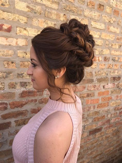 high bun wth twists curls loose waves updo style for weddings proms special events hair