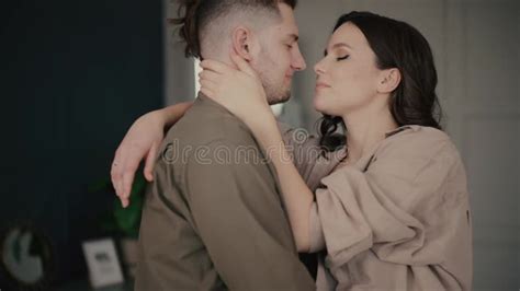 Young Husband Kisses Lady Spending Time Together In Room Stock Footage