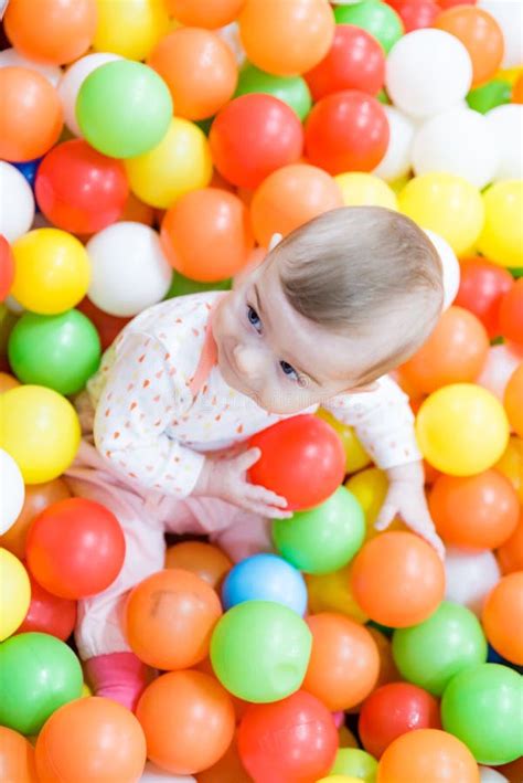 Baby Girl Playing With Colorful Balls Stock Image Image Of Cheerful