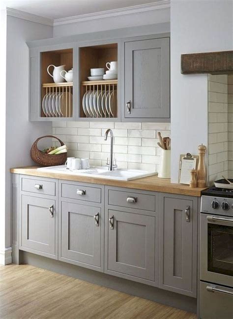 We loved the shade of the gray in this grey shaker kitchen cabinet! 70+ Amazing Farmhouse Gray Kitchen Cabinet Design Ideas