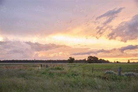 Image Of Colourful Sunset Over Farmland Austockphoto