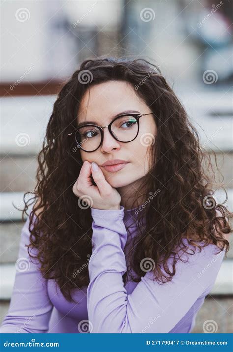 Beautiful Young Woman With Brunette Curly Hair Portrait In Eye Glasses Enjoying The Sun Stock