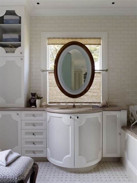 A bathroom mirror that is also a medicine cabeinet. The Best Oval Mirrors for your Bathroom | Decor Snob
