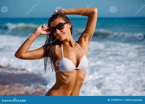 Portrait Of Beautiful Tanned Woman Posing In Colorful Swimwear Bikini