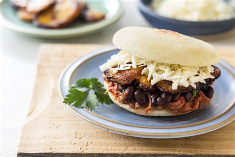 Arepa Filled With Shredded Beef Black Beans Fried Plantain And White Cheese