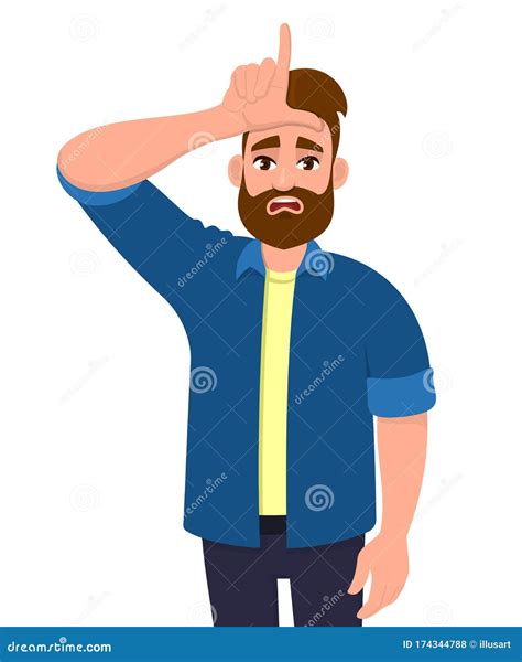 Unhappy Young Hipster Man Showing Loser Sign On Forehead With Fingers