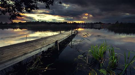 Wallpaper Pier Lake Bridge Grass Black Clouds Dusk 2560x1600 Hd