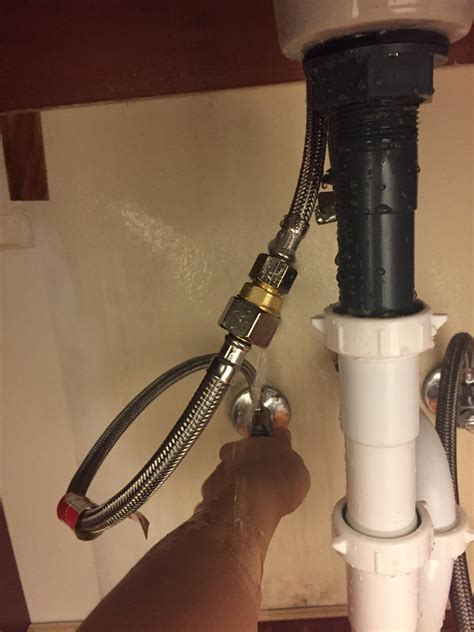 Hold the underneath centerpiece and use a. leak - Leaking hose from new bathroom faucet - Home ...