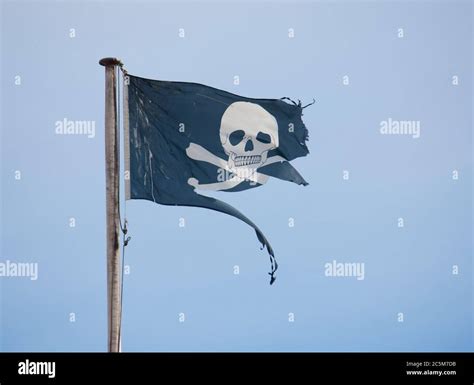 Tattered Jolly Roger Pirate Flag Stock Photo Alamy