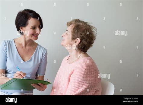 Doctor Woman Asking Questions Elderly Female Stock Photo Alamy