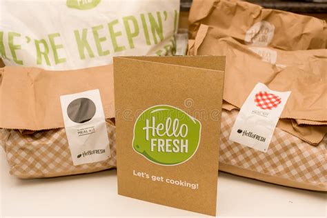 Hello Fresh Meal Kits Packed In Paper Bags On A White Table Editorial