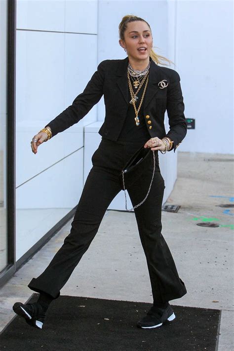 Miley Cyrus In A Black Sneakers Arrives At The Chanel Store In La