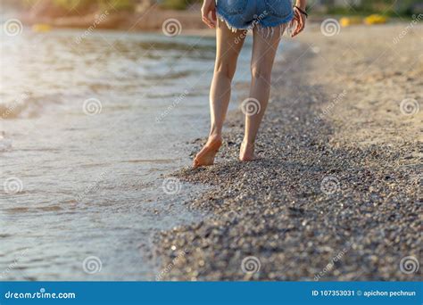 Legs Of Women Walking On The Beach At Sunset Stock Image Image Of