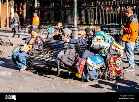 Homeless People Group Together On Bench Seats In New Orleans La Stock
