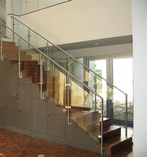 Our Stainless Railing With Rounded Glass Clamps Make This Staircase The