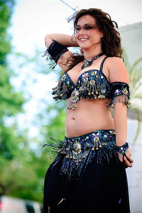 A Belly Dancer Is Posing For The Camera
