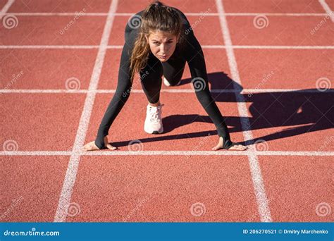 Fit Woman Sprinter On A Treadmill Rubber Stadium Or Running Track