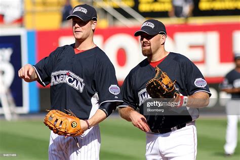 Kevin Youkilis Of The Boston Red Sox Right And Justin Morneau Of