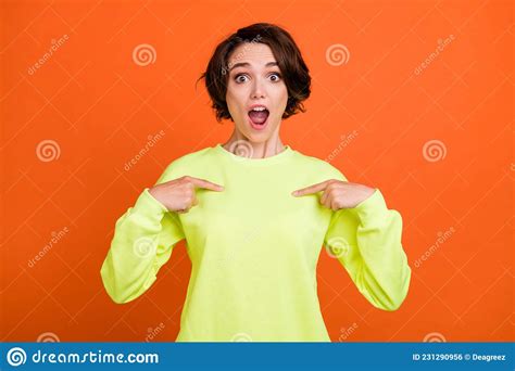 Portrait Of Attractive Cheerful Amazed Girl Demonstrating Herself Isolated Over Vibrant Orange
