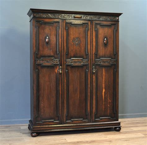 Attractive Large Antique Carved Oak Triple Fitted Wardrobe 685616