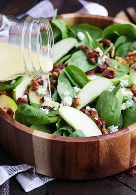 This spinach salad is tossed with apple vinaigrette made with finely diced apple, vinegar, and finely this spinach salad is delicious with crumbled bacon. Apple-Cranberry-Spinach-Salad-2 - 3 Yummy Tummies