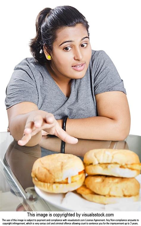 Hungry Indian Fat Woman Reaching For Burger On Table With Temptation