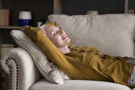Serene Older Woman Put Hands Behind Head Relaxing On Sofa Stock Image Image Of Head Enjoy