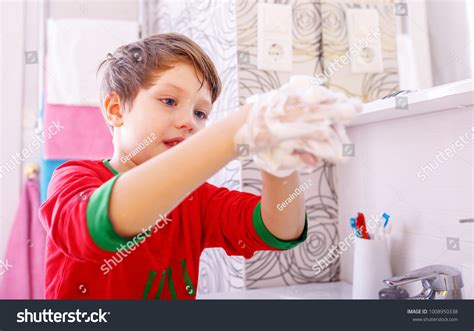 Cheerful Child Washing Hands Showing Soapy Stock Photo 1008950338