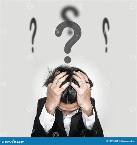 Confused Businessman With Question Marks Sign On Head Stock Photo