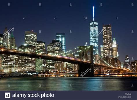 The New York City Skyline At Night W Brooklyn Bridge And