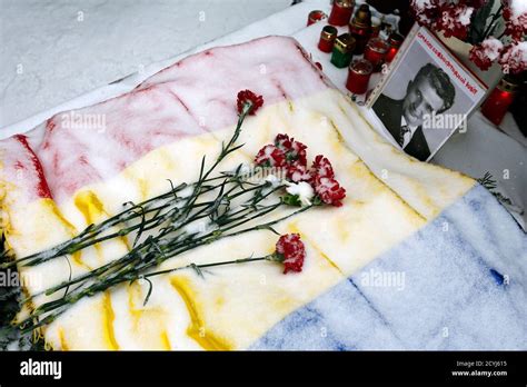 A Snow Covered National Flag Is Seen Over The Grave Of Romanias Late