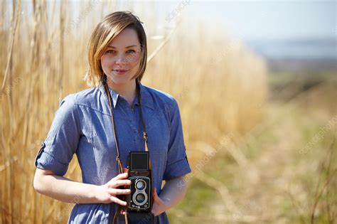 Woman Holding Camera Stock Image F0085313 Science Photo Library