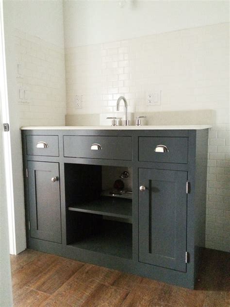 Houseful of handmade has a built a bathroom vanity that is 8 foot long with enough from for two sinks and is mission style with drawers, cabinets, and open storage. Creative DIY Bathroom Vanity Projects • The Budget Decorator